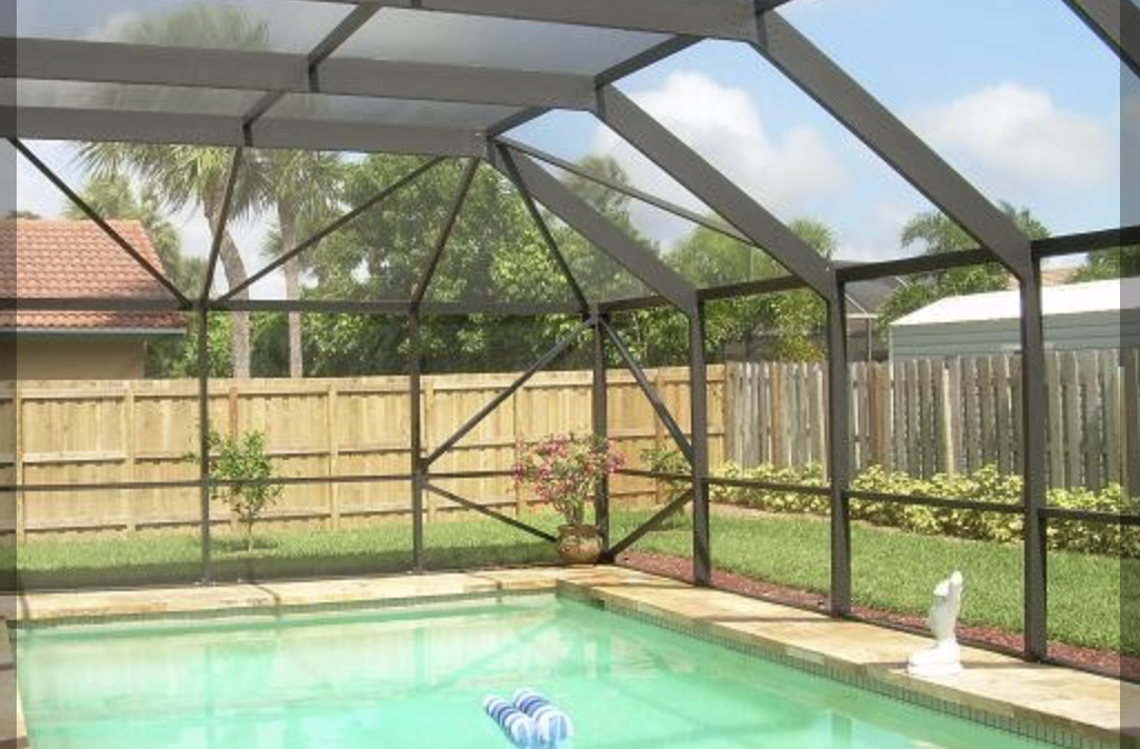 Picture of a stunning pool with a custom-built cage adding to its beauty